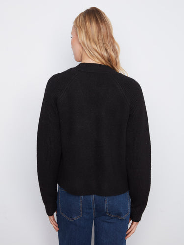 Stylish black cardigan showcasing raglan sleeves and practical patch pockets by Charlie B.