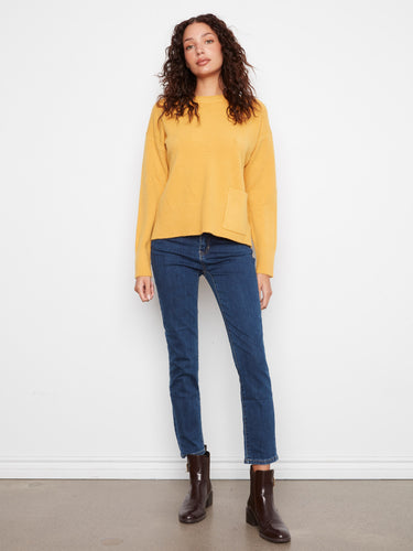 Designed with side slits, this sweater offers a relaxed fit and stylish flair. By Charlie B.
