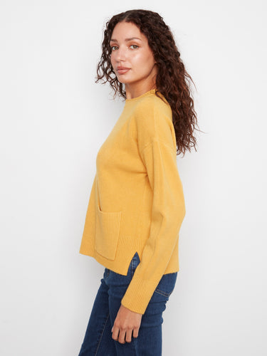 The patch pocket adds both style and functionality to this cozy sweater. By Charlie B.