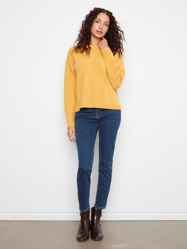 Pair it with jeans or skirts for effortless style that transitions easily through seasons. By Charlie B.