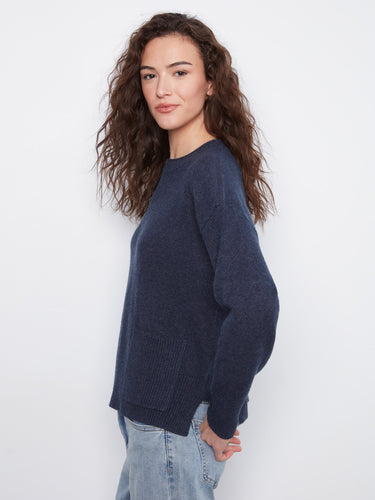 Elegant navy sweater with a practical patch pocket, combining style and functionality effortlessly. By Charlie B.