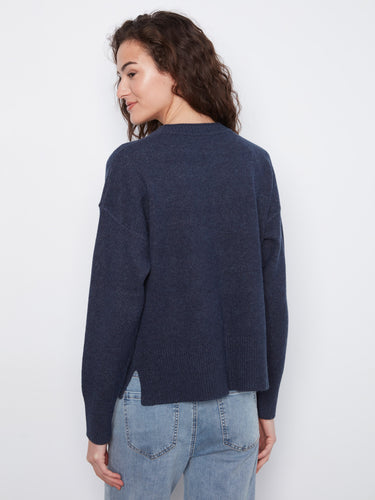 Navy blue drop shoulder sweater offering relaxed elegance and modern design for everyday wear. By Charlie B.