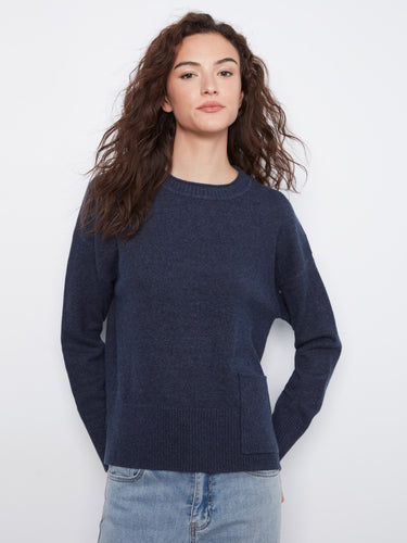 Chic navy sweater designed with versatility in mind, ideal for layering or wearing alone on cool days. By Charlie B.