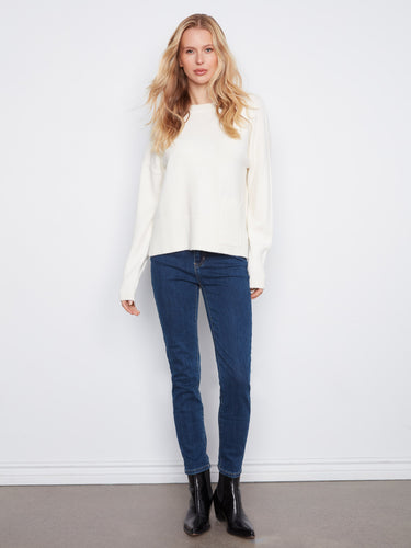 This cozy sweater features side slits, adding subtle style and comfort to your everyday look. Designed by Charlie B.