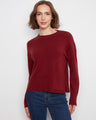 Red sweater with a classic crew neck, featuring drop shoulders for a relaxed fit. The design exudes casual elegance by Charlie B.