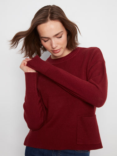 Featuring a practical patch pocket, this red sweater combines functionality with fashion effortlessly by Charlie B.