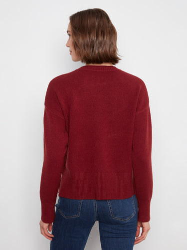 Enjoy the effortless elegance of its slit hem, ideal for layering or standalone wear. By Charlie B.