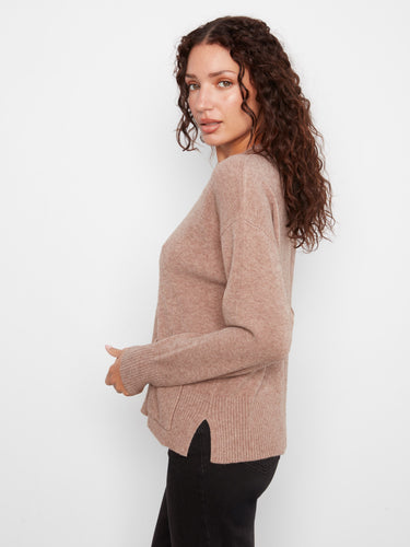 Chic sweater featuring side slits for added comfort and style, ideal for layering. By Charlie B.
