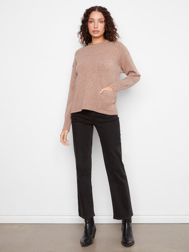 Cozy sweater with a practical patch pocket, blending functionality with fashion effortlessly. By Charlie B.