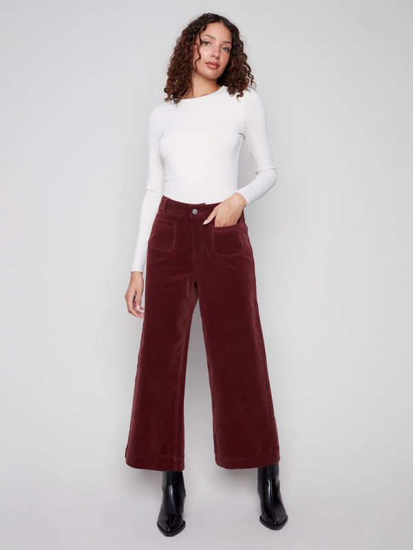 Cabernet corduroy pants featuring a stylish flare leg and button front closure, perfect for a chic look by Charlie B.