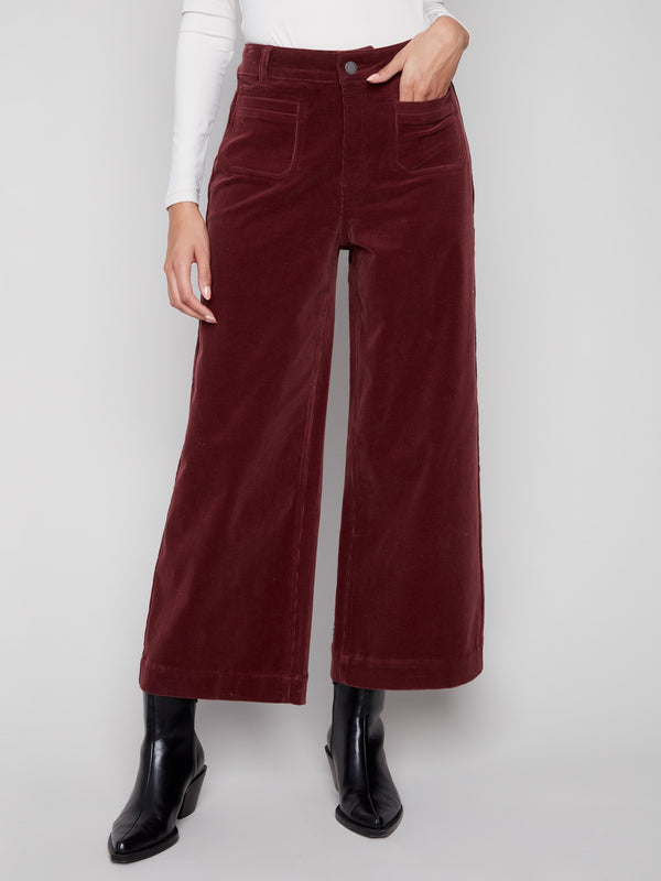 These pants offer a cropped length with two front patch pockets, adding practicality to style by Charlie B.