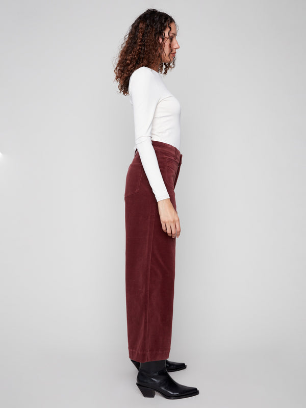 Featuring two back patch pockets and regular rise, these flare pants blend functionality with fashion by Charlie B.