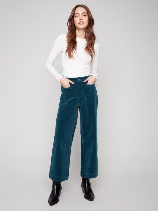 Cropped corduroy pants in evergreen with two front patch pockets for a stylish touch by Charlie B.
