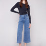 Stylish medium blue jeans with a flare fit and modern patch pockets, crafted from stretch denim for comfort by Charlie B.