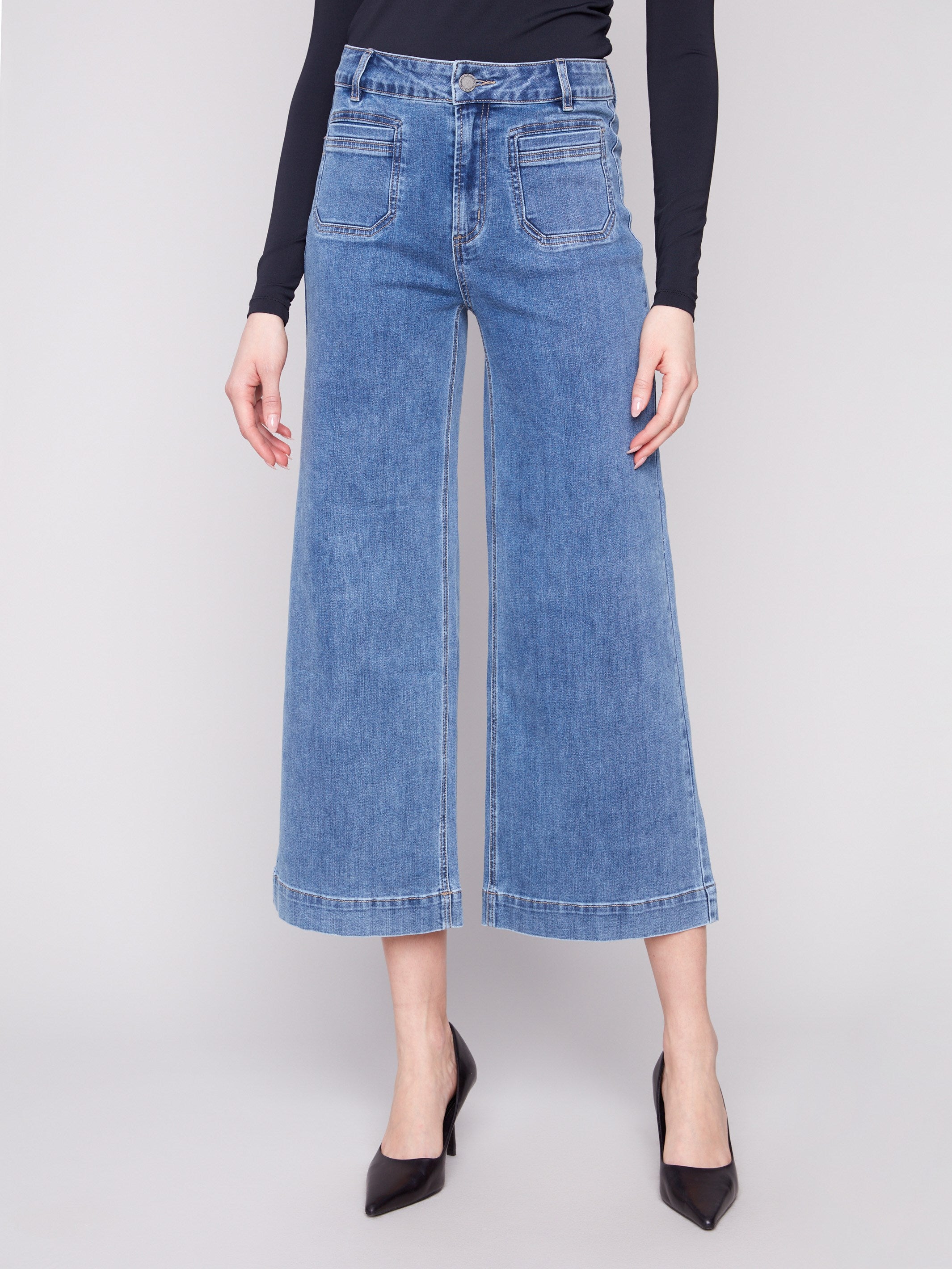 Chic cropped length jeans in medium blue with front and back pockets, offering a trendy and versatile style by Charlie B.