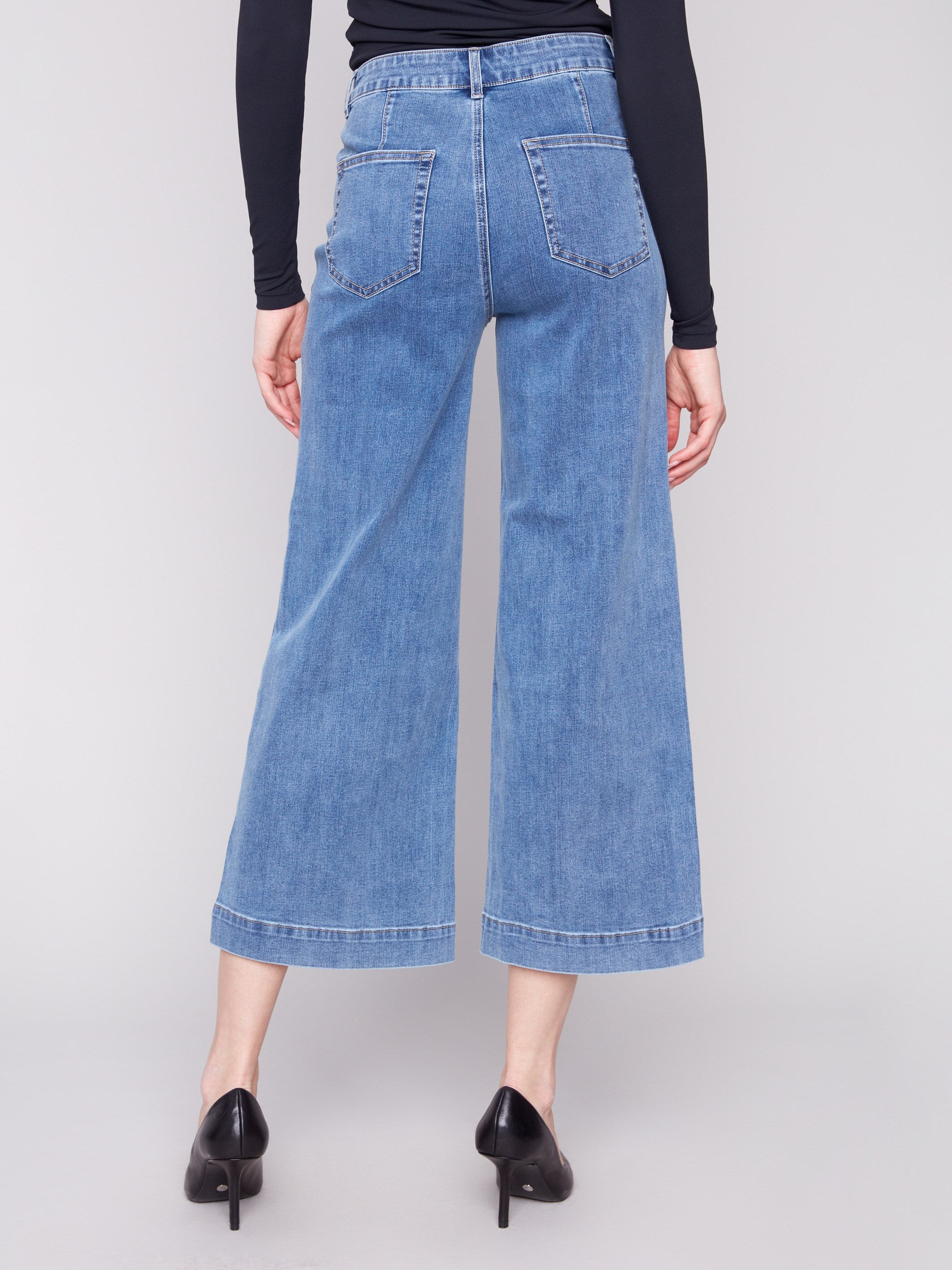 Medium blue jeans featuring a flattering flare fit and regular rise, perfect for casual or dressy occasions by Charlie B.