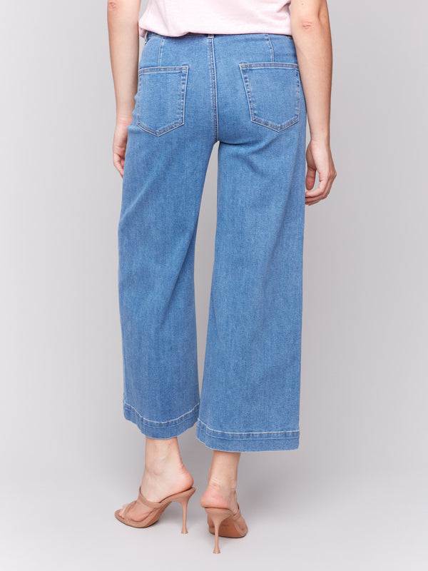 Blue denim flare jeans with front patch pockets and regular rise by Charlie B.