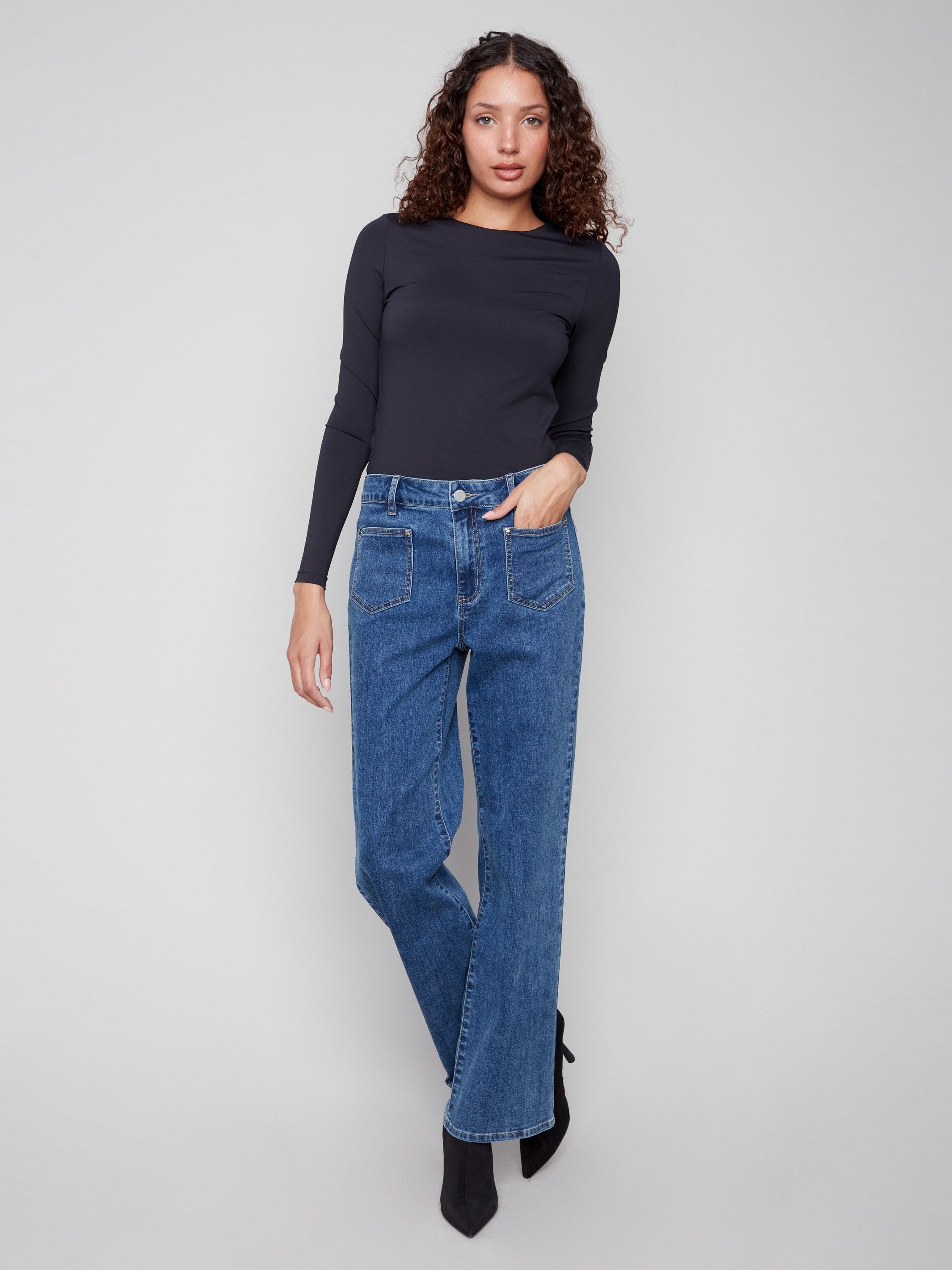 Medium blue jeans with a stylish flare leg, crafted from stretch denim for comfort and style by Charlie B.