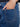 The special rivets add a touch of unique detail to these medium blue flare jeans by Charlie B.