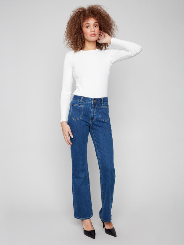 Indigo jeans with a flare leg design, crafted from stretch denim for added comfort and style by Charlie B.