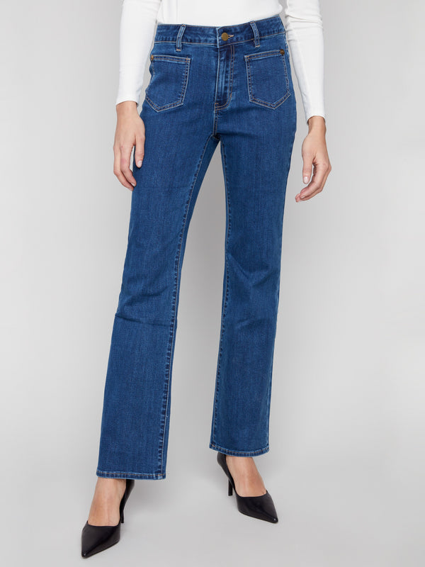 These indigo jeans feature a long length and front patch pockets, offering both functionality and fashion by Charlie B.