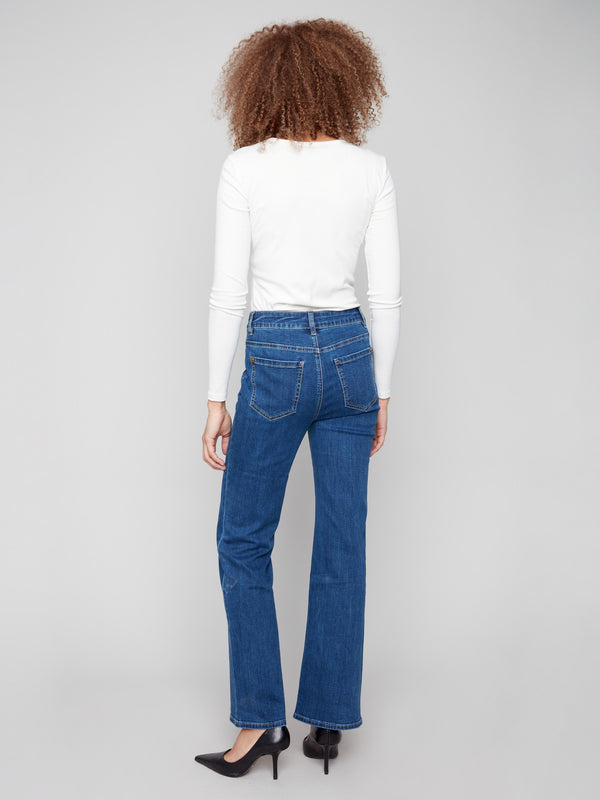 Stylish indigo jeans showcasing back pockets and stretch denim material for everyday wear by Charlie B.