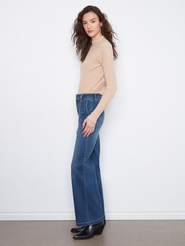 The double-button waistband adds a touch of sophistication to these versatile denim jeans. By Charlie B.