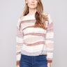 Cozy knit sweater featuring a classic crew neckline and stylish ribbed cuffs for added texture by Charlie B.
