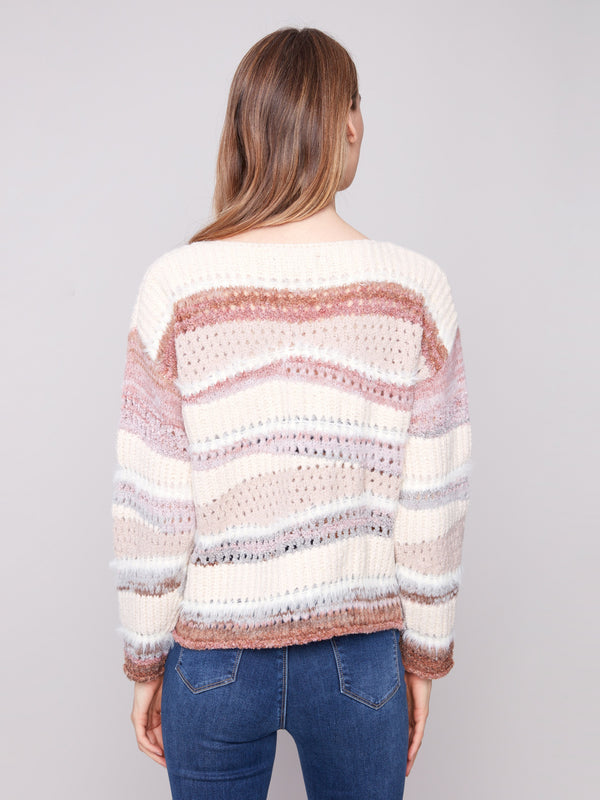 The crew neckline complements the casual yet chic aesthetic of this cozy striped sweater by Charlie B.