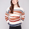 Striped patchwork knit sweater featuring a cozy crew neckline for added comfort by Charlie B.