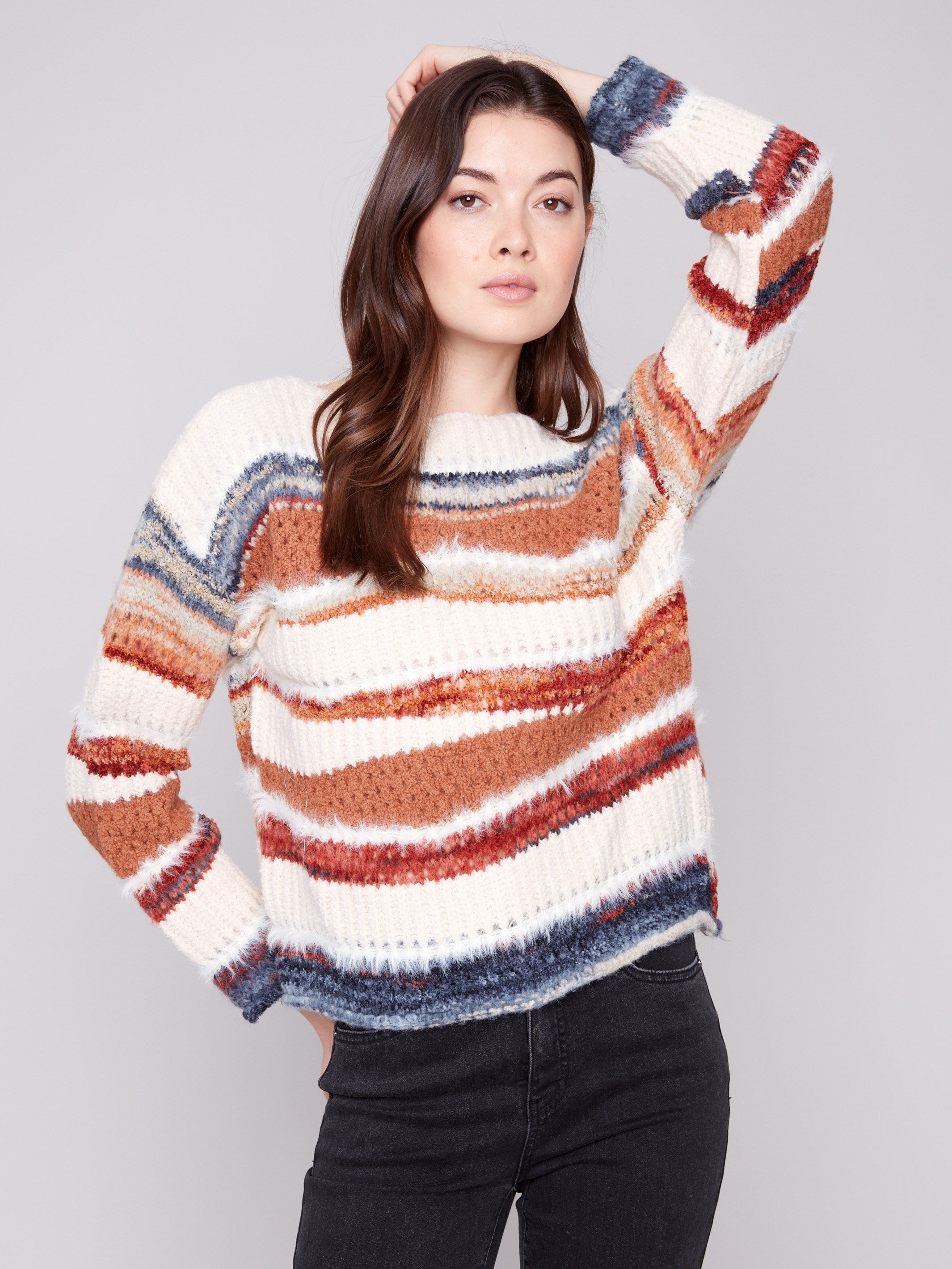 Showcasing the stylish drop shoulder design, this striped sweater adds a modern touch by Charlie B.