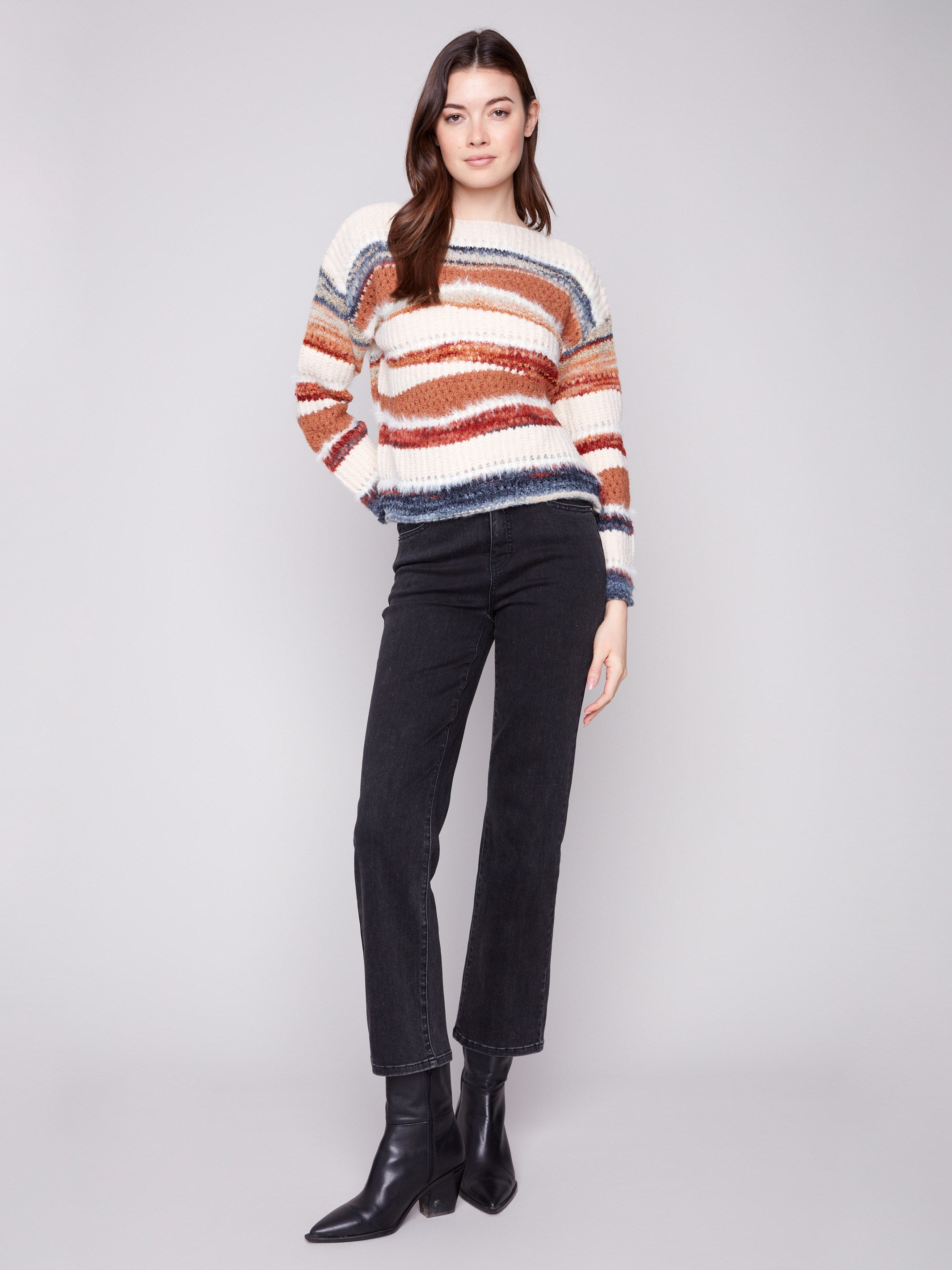 Patchwork knit sweater with vibrant stripes and a classic crew neckline for versatile styling by Charlie B.