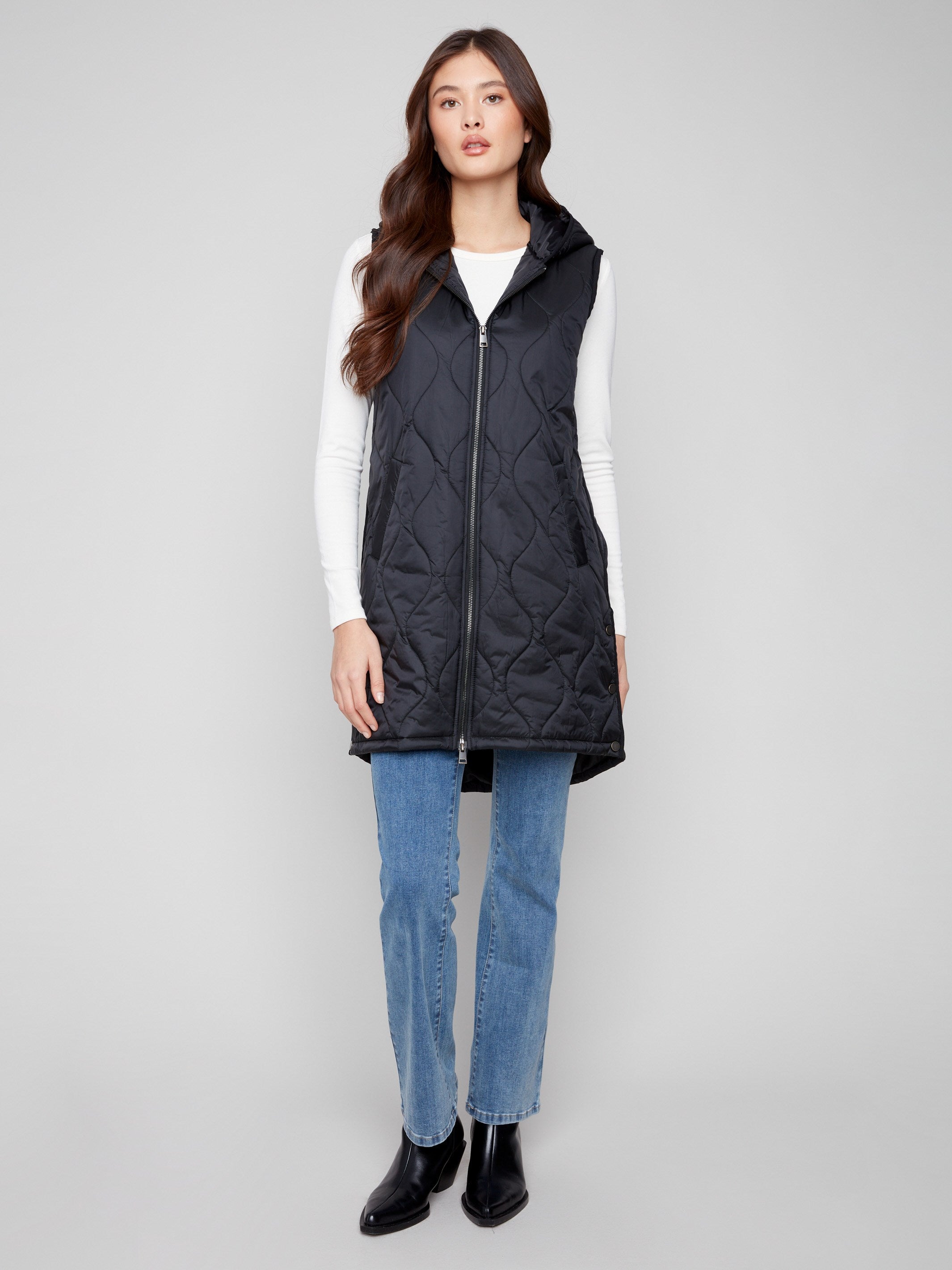 Black long vest with a sleek zipper front closure, offering both style and functionality by Charlie B.