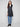 Black long vest with a sleek zipper front closure, offering both style and functionality by Charlie B.