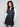 Long black vest with an elegant pearlized finish, adding a touch of shine to your look by Charlie B.