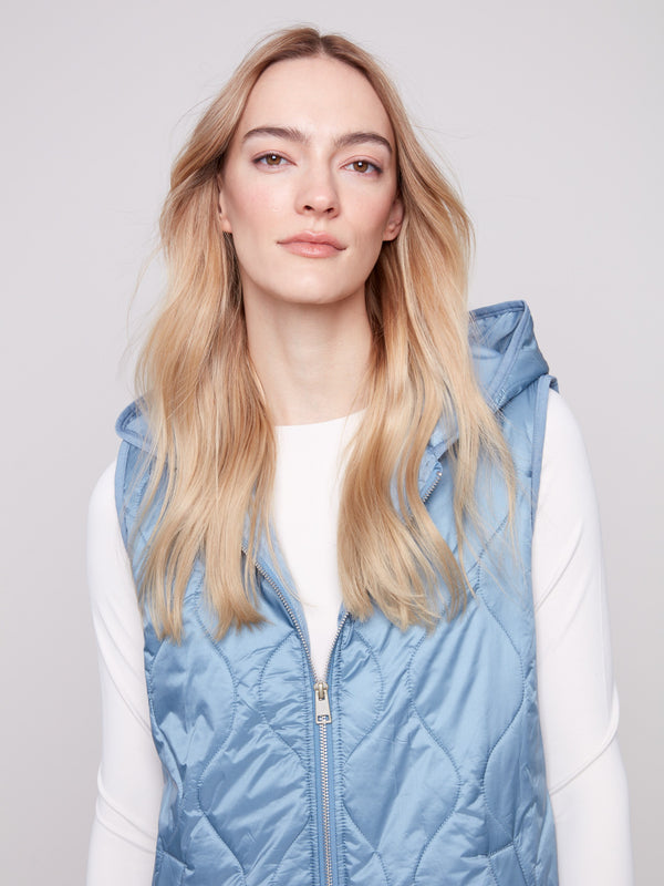 Vest with stylish welt pockets and a modern quilted design by Charlie B.