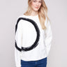 Ecru sweater with a bold black abstract circle and ribbed cuffs, offering a stylish touch by Charlie B.