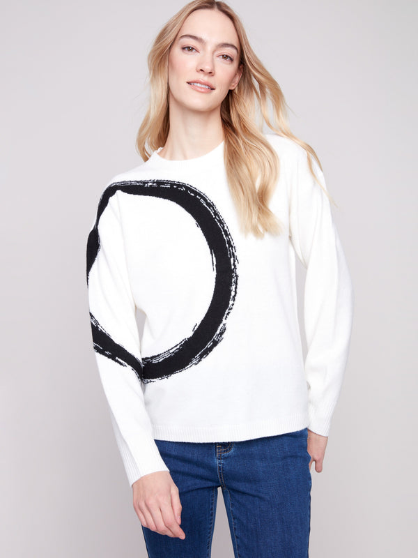 Long sleeves add to the charm of this ecru sweater featuring an artistic black abstract circle design by Charlie B.