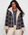 Navy plaid boucle jacket with a cozy stand collar and sherpa trim, featuring button-front closure by Charlie B.
