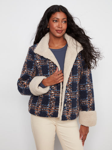 Fashionable navy plaid boucle jacket showcasing a short length design and luxurious sherpa detailing by Charlie B.