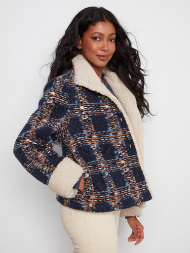 Elegant navy plaid boucle jacket featuring a classic button-front closure and plush sherpa cuffs by Charlie B.