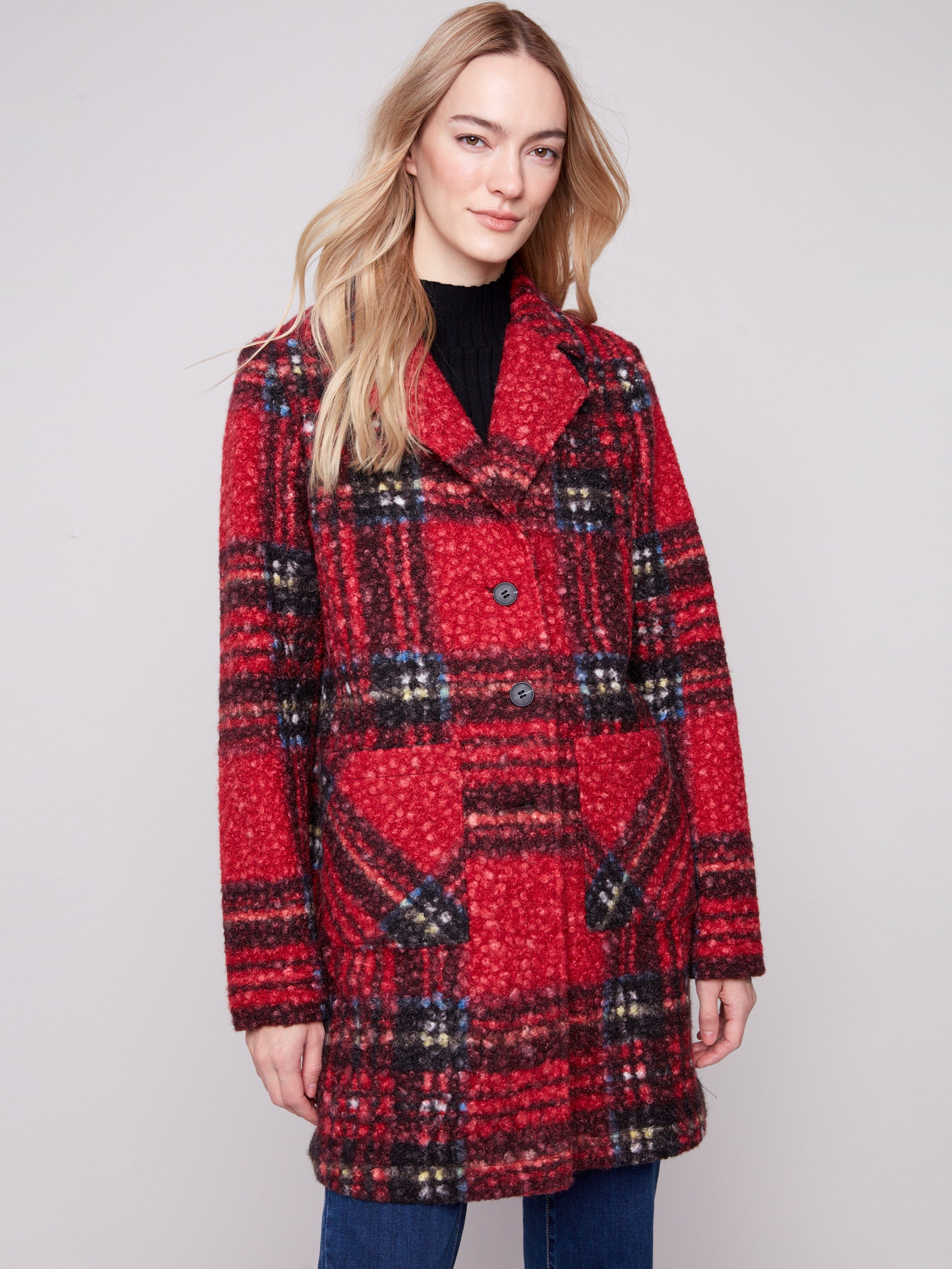 This cranberry plaid boucle knit coat features a classic button front closure, perfect for versatile styling by Charlie B.