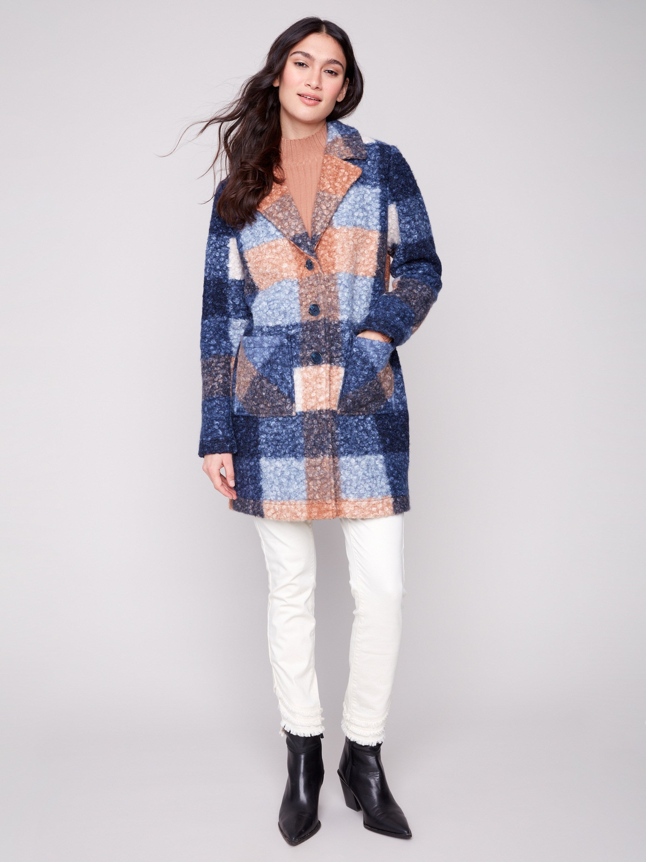 Chic plaid design in a cozy boucle knit fabric, complete with tailored details for modern flair by Charlie B.
