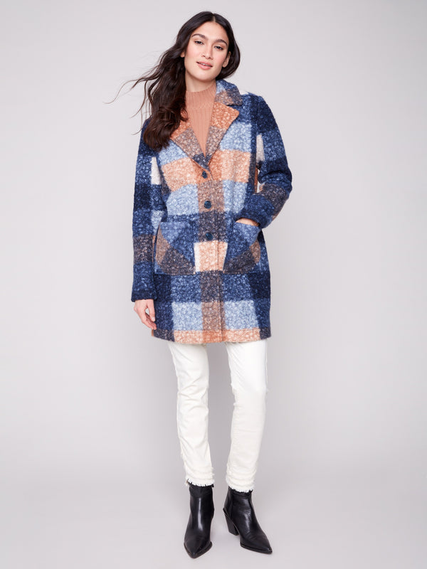Chic plaid design in a cozy boucle knit fabric, complete with tailored details for modern flair by Charlie B.