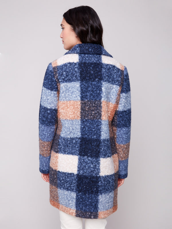 Versatile and stylish plaid coat crafted from high-quality boucle knit material, offering warmth and elegance by Charlie B.