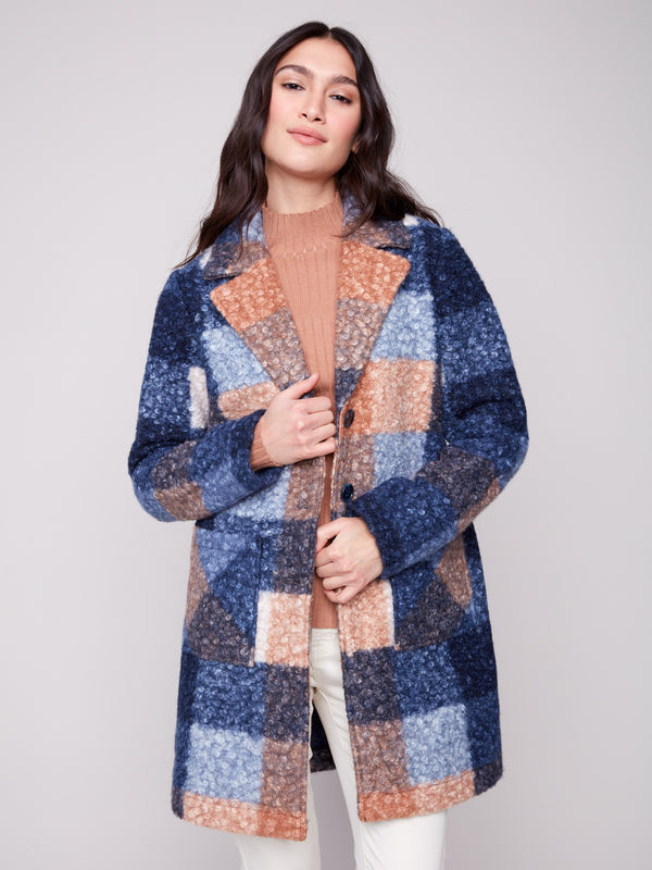 Fashion-forward plaid boucle coat showcasing a sleek button front and functional patch pockets by Charlie B.
