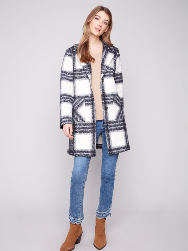 Plaid boucle knit coat in black and white with a chic tailored collar, offering stylish patch pockets for convenience by Charlie B.