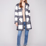 Plaid boucle knit coat in black and white with a chic tailored collar, offering stylish patch pockets for convenience by Charlie B.