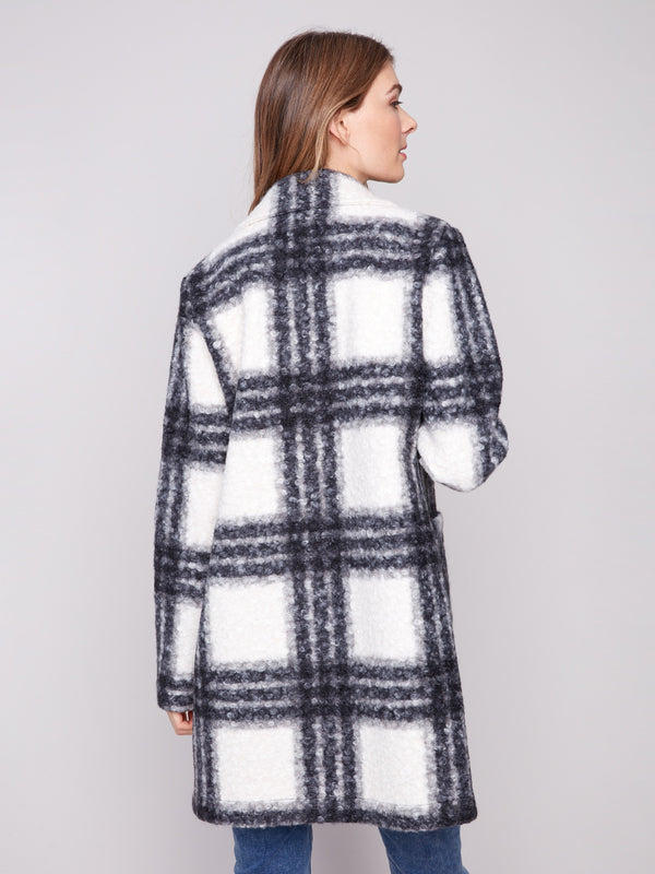 Black and white plaid coat made from luxurious boucle knit fabric, highlighted by its sleek tailored collar for elegance by Charlie B.