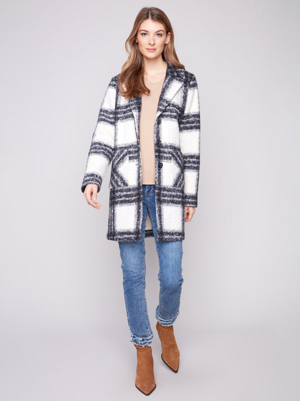 Cozy up in this black and white plaid coat with tailored collar, designed with convenient patch pockets to keep essentials handy. By Charlie B.